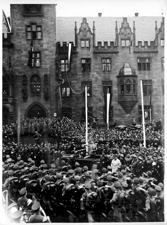 Hitler salutes the parade in front of the town hall in Saarbrücken